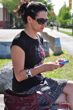 Brunette babe smoking at the park - N