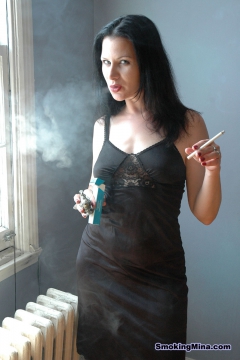 Busty babe smoking and getting nude - N