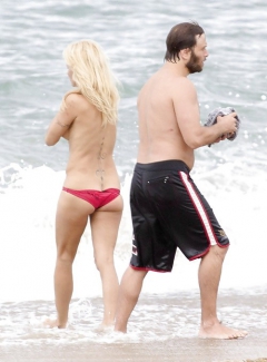 Pamela Anderson Goes Topless on a Beach in France - N