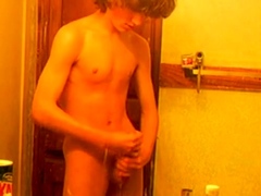 Curly-haired twink in bathroom