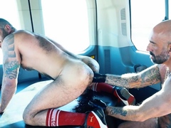 Hairy inked hunk fist fucked in the van